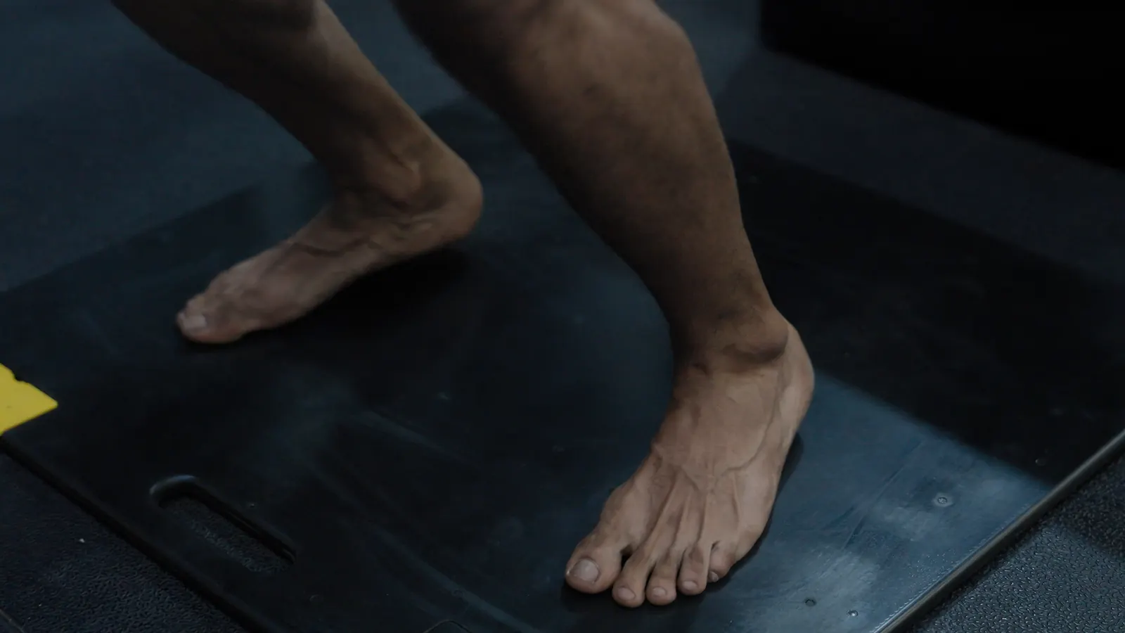 Athlete's bare feet on a force plate before a jump test