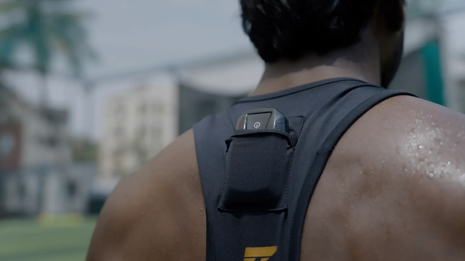 GPS unit sitting in the back pocket of an athlete's training vest