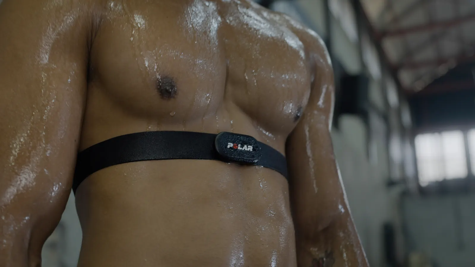 Heart-rate chest strap on an athlete mid-session