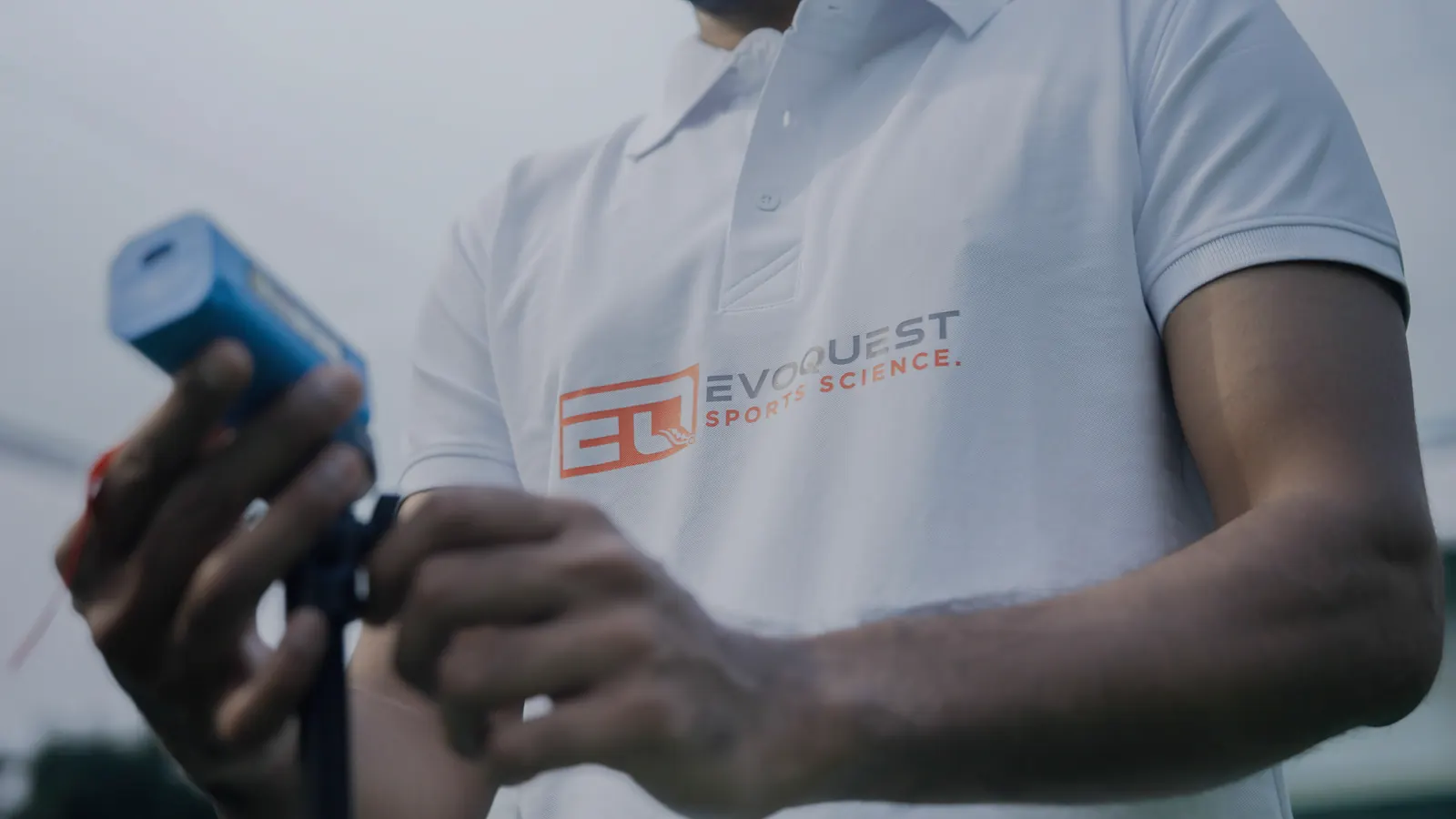 EvoQuest coach setting up a testing sensor on the pitch